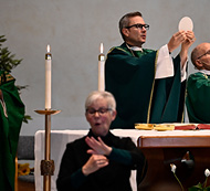 American sign language interpreter at Mass presided by Bishop Hicks